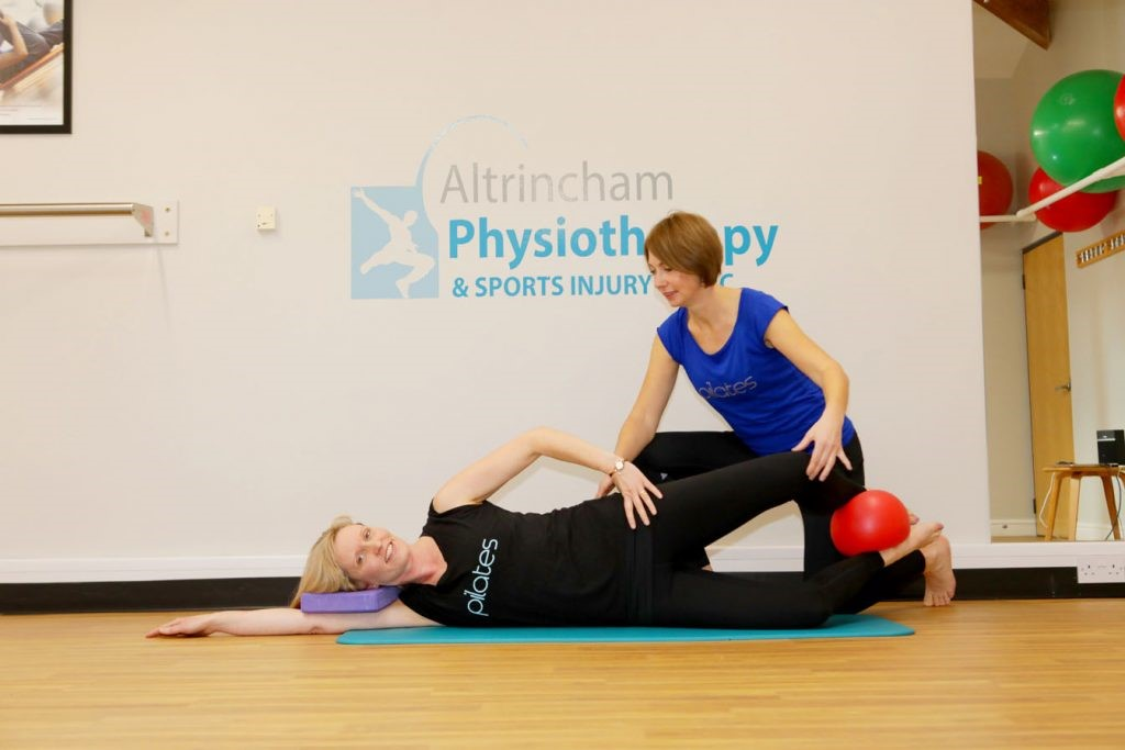 Woman treating a physiotherapy
patient 